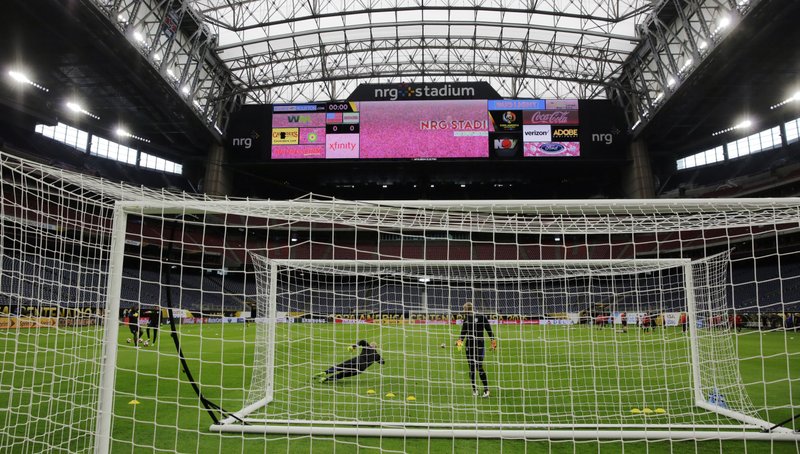 U.S. goalkeeperd Brad Guzan, left, and Tim Howard, right, go through drills during a Copa America Centenario soccer training session Monday, June 20, 2016, in Houston, for a Tuesday semifinal against Argentina. 