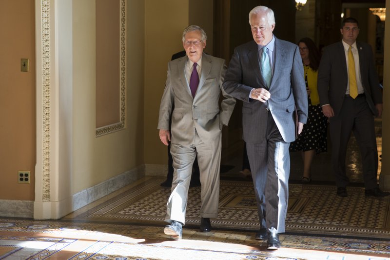 Senate Majority Leader Sen. Mitch McConnell, R-Ky., left, and Sen. John Cornyn, R-Texas, arrive for a vote on Capitol Hill, Monday, June 20, 2016, in Washington. A divided Senate hurtled Monday toward an election-year stalemate over curbing guns.