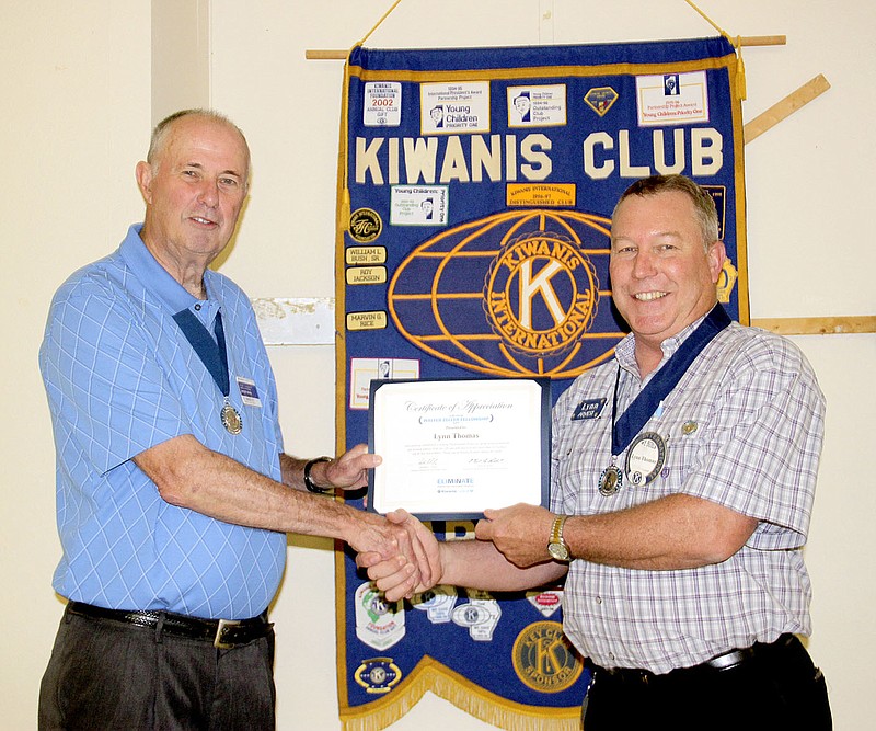 LYNN KUTTER ENTERPRISE-LEADER Jerry Martin, left, with Kiwanis&#8217; Mo-Ark District, recognizes Lynn Thomas as a Walter Zeller Fellow for his participation with the organization&#8217;s international Eliminate Project, a program to raise money to eliminate maternal and neonatal tetanus.