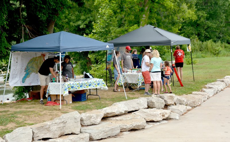 Michael Burchfiel/Herald-Leader The Illinois River Watershed Partnership helped host the river splash day and brought displays to increase awareness of environmental conservation.