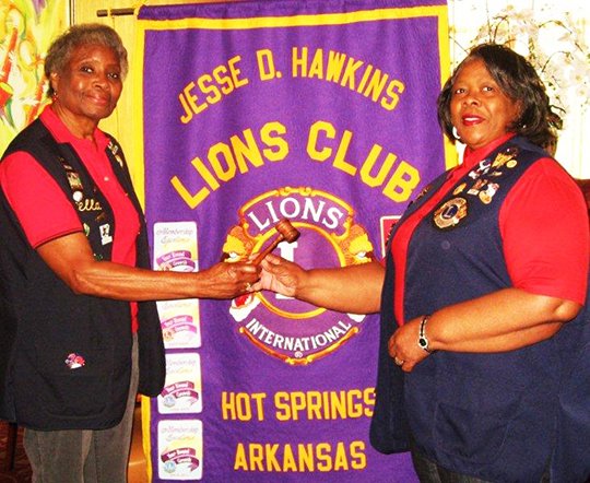 Submitted photo Jesse D. Hawkins Lions Club Immediate Past President Mozella Anderson, left, passes the president's gavel to 2016-2017 President Margie Perkins.