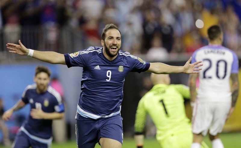 Forward Gonzalo Higuain (9) celebrates after scoring a goal in Argentina’s 4-0 victory over the United States on Tuesday in the Copa America semifinals at NRG Stadium in Houston. 