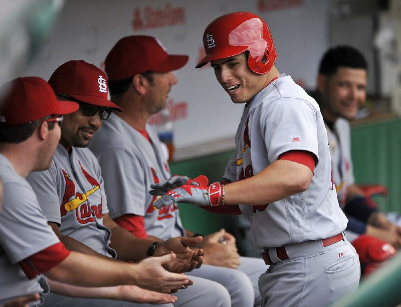 Aledmys Diaz celebrates in the dugout with his St. Louis Cardinals teammates after hitting a two-run home run against the Chicago Cubs on Wednesday. The Cardinals won 7-2.