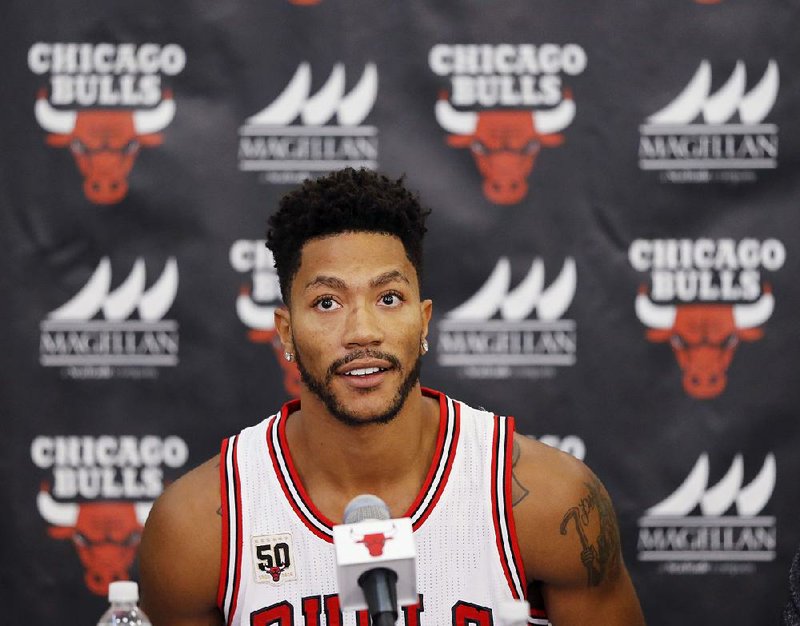 In this Sept. 28, 2015, file photo, Chicago Bulls' Derrick Rose sits down for an NBA basketball media day news conference in Chicago.  