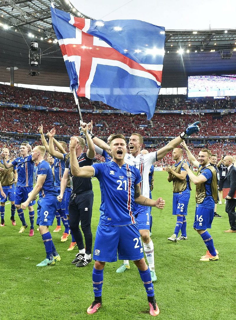 Iceland players elebrate after Wednesday’s 2-1 victory over Austria in the European Championship at Saint-Denis, France.