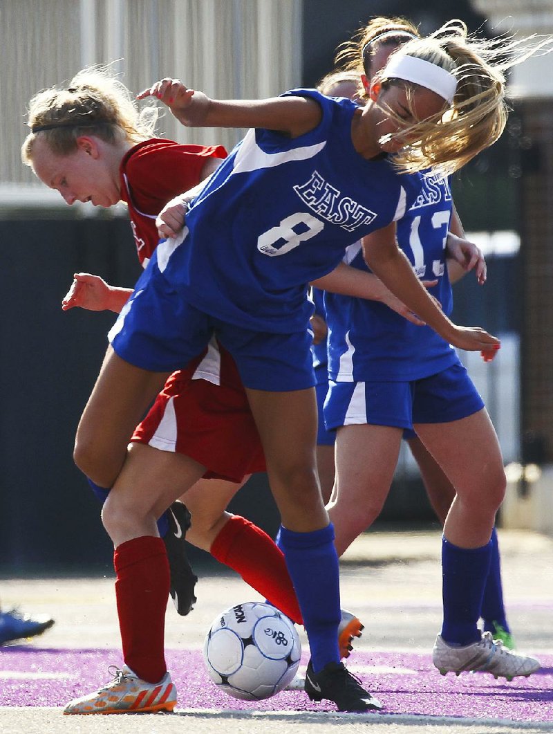 Bryant’s Anna Lowery (8), playing for the East, battles with a West opponent for the ball in the East’s 3-1 victory at Central Arkansas’ Estes Stadium on Wednesday.