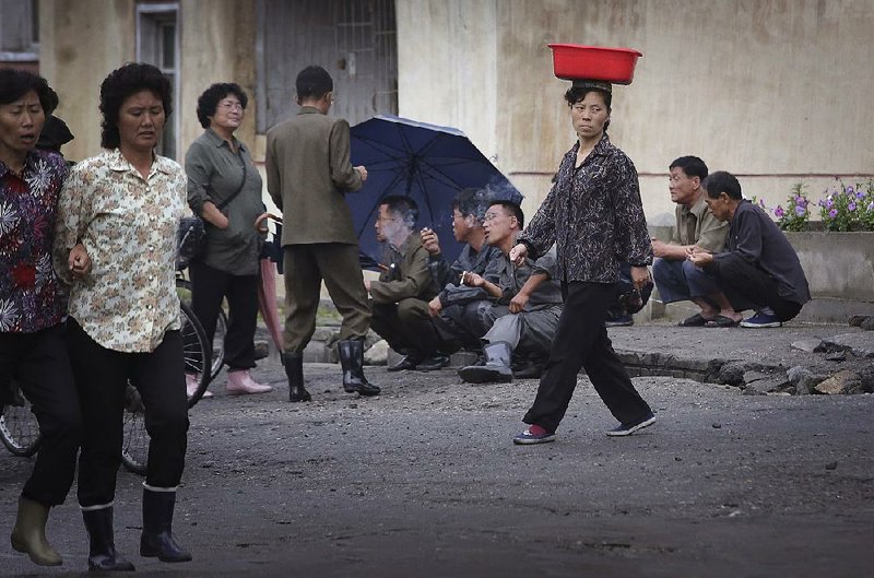 People mingle Wednesday in a street of Wonsan, North Korea, the port city from which the country launched an intermediate-range ballistic missile earlier in the day. 