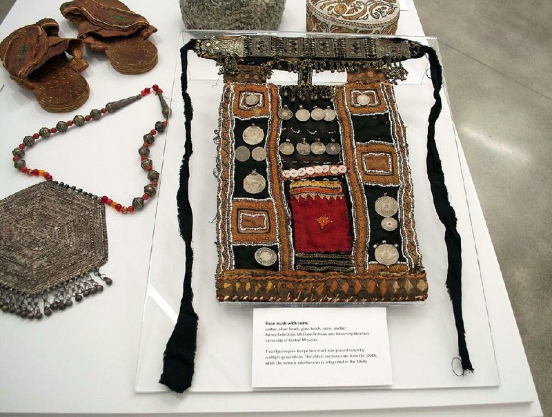 “Traditional Arts of the Bedouin,” including this mask with coins and beads, is on display through Aug. 5 at the University of Arkansas at Little Rock’s galleries, 2801 S. University Ave. Admission is free. Hours are 10 a.m.-4 p.m. Monday-Friday. Call (501) 569-8977.

