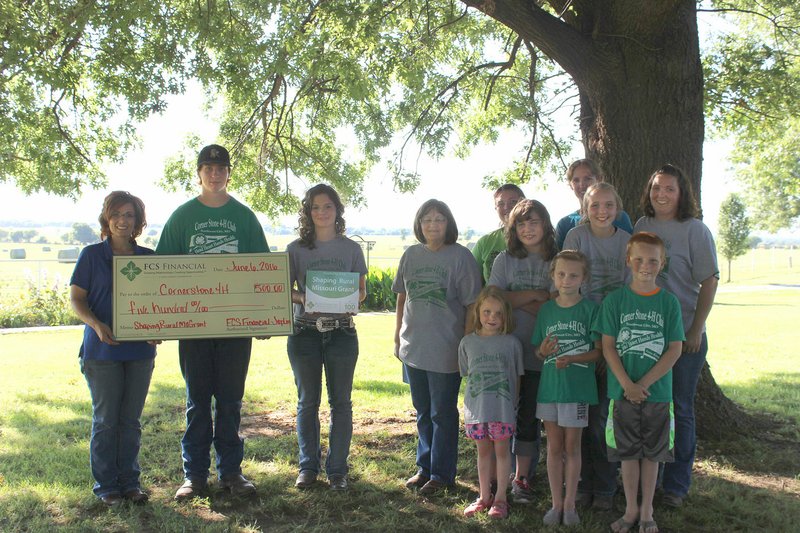 MEGAN DAVIS/MCDONALD COUNTY PRESS Members of Cornerstone 4H received a $500 &quot;Shaping Rural Missouri&quot; grant from Financial Credit Services on Monday, June 6. The money was used to beautify the grounds around the Southwest City Senior Center.