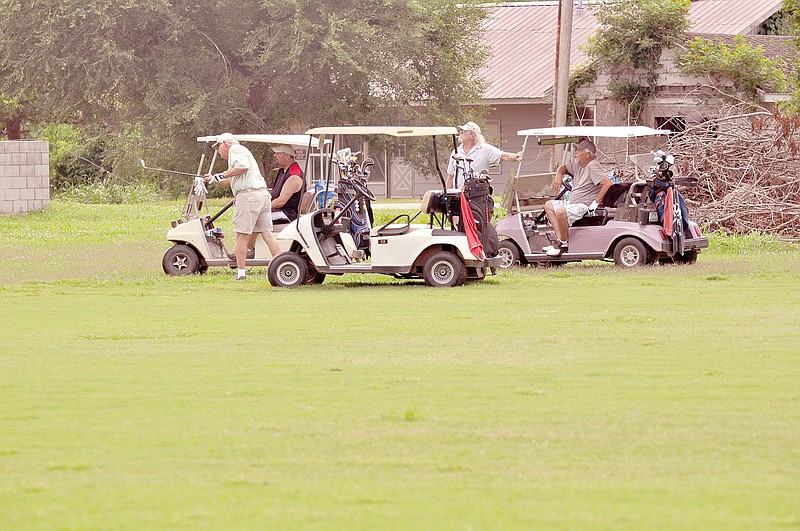 RACHEL DICKERSON/MCDONALD COUNTY PRESS A group of golfers play at Elk River Golf Club, which is almost back to normal after the December flood.