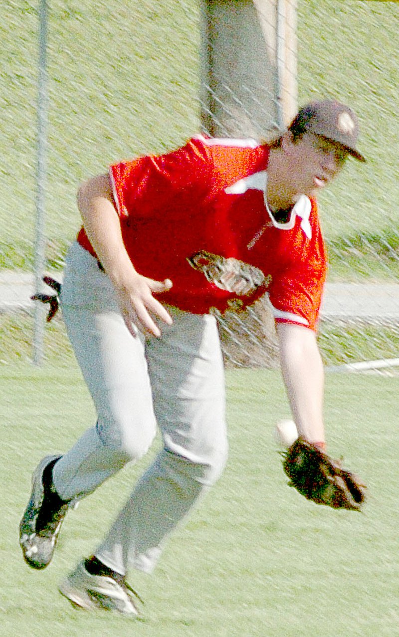 Photo by Rick Peck McDonald County right-fielder Jon Martin attempts to make a catch of a sinking line drive during the McDonald County 18U baseball team&#8217;s 5-2 win over Seneca on June 16 in Seneca.