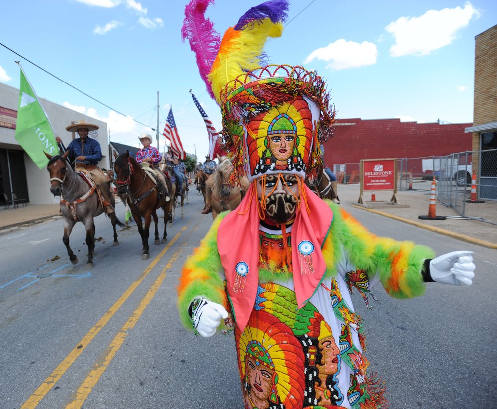 Wagon masters deliver guests on Springdale's rodeo's stagecoach