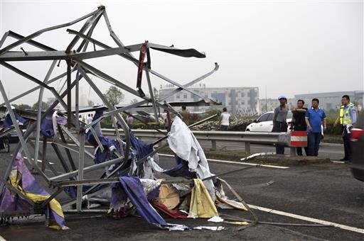 The remains of a steel tower are photographed in Funing County, in east China's Jiangsu Province, on Thursday, June 23, 2016, after a tornado hit the area. 