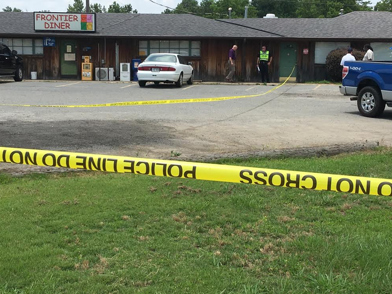 Authorities work the scene of a fatal shooting at the Frontier Diner in Little Rock.