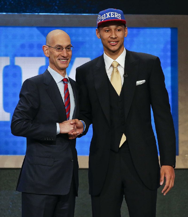 NBA Commissioner Adam Silver (left) congratulates Ben Simmons, of LSU, after he was selected as the No. 1 overall pick in the NBA Draft on Thursday night in Brooklyn, N.Y.