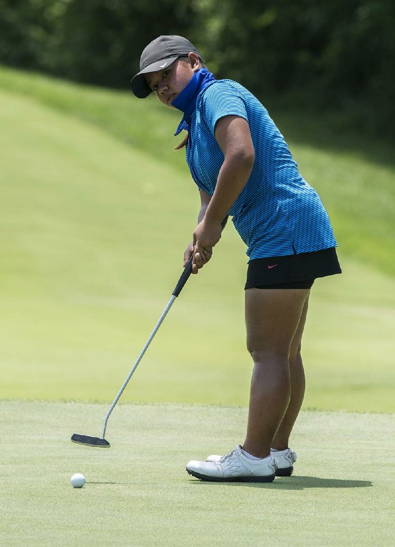 Harmie Constantino of the Phillipines watches a putt on the fourth hole during Thursday’s fi nal round of the Stacy Lewis Junior All-Star Invitational at the Blessings Golf Course in Johnson. Constantino shot a final-round 67 to win by six shots over Jayna Choi of Collierville, Tenn. 