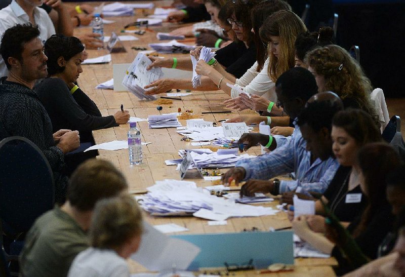 Ballots are tallied Thursday in London as counting gets underway from the referendum on the United Kingdom’s membership in the European Union.