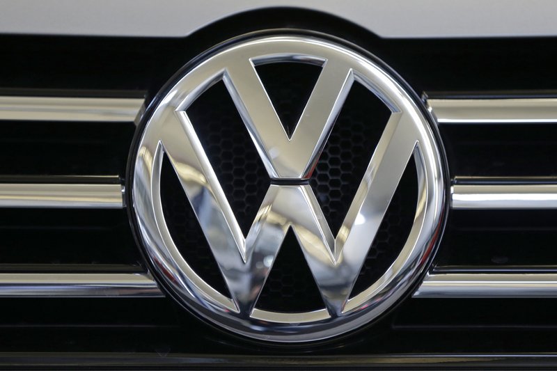 FILE - In this Feb. 14, 2013, file photo, the Volkswagen logo is seen on the grill of a Volkswagen on display in Pittsburgh. (AP Photo/Gene J. Puskar, File)