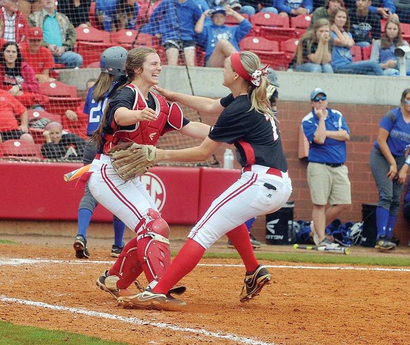 Vilonia catcher Morgan Gray, left, and pitcher Sydney Wader celebrate after beating Greenbrier in the Class 5A state championship game at Bogle Park in Fayetteville last month. Wader is the 2016 River Valley & Ozarks Edition Softball Player of the Year.