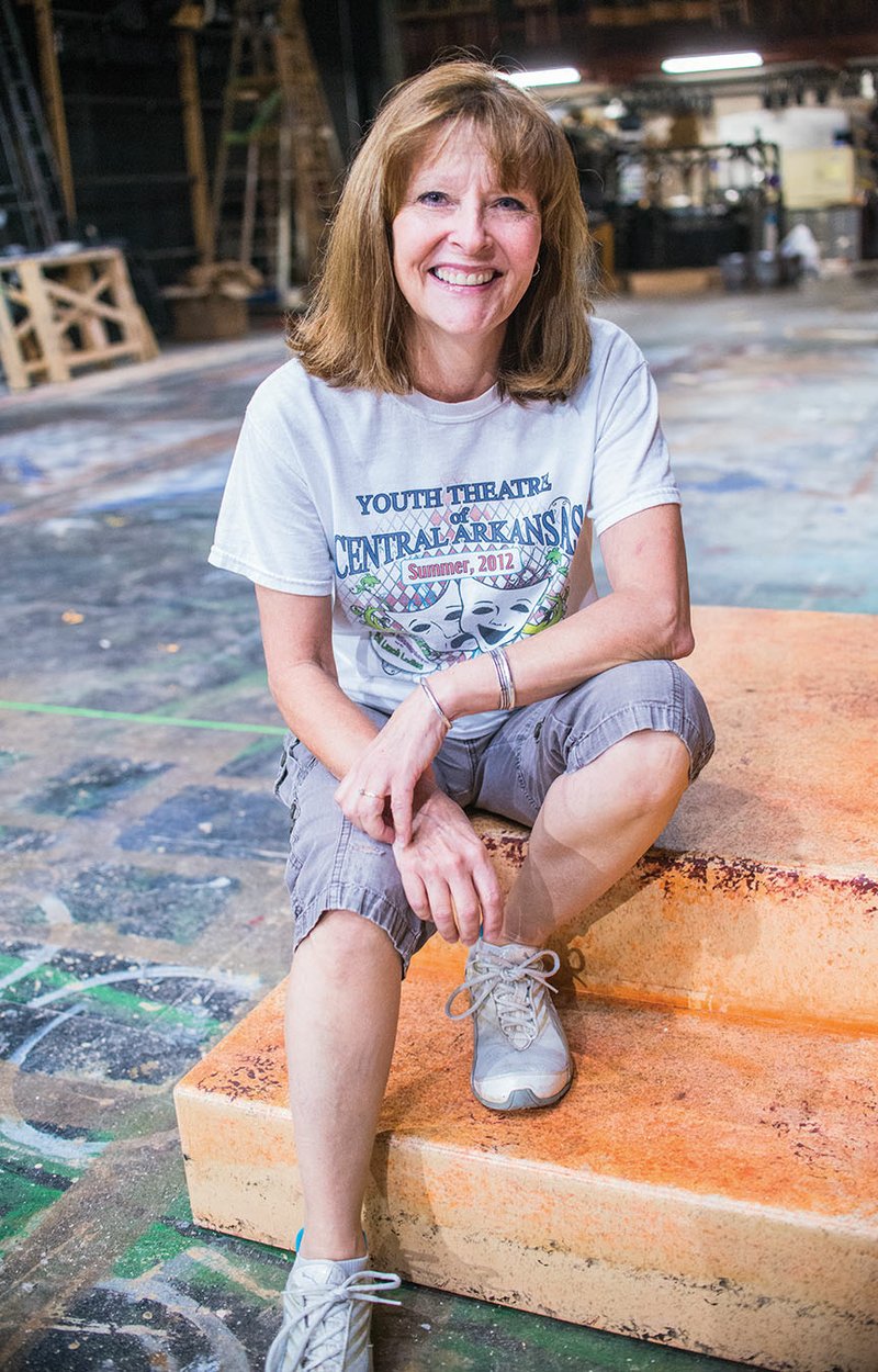 Ruthann Curry Browne of Conway sits on steps on the Bridges/Larson Theatre stage in the Snow Fine Arts Center at the University of Central Arkansas. Browne, director of Youth Theatre of Central Arkansas, started acting at age 10 and directed actor Edward Norton in his first stage play in New York City.