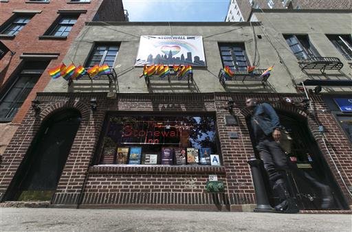 In this May 29, 2014, file photo, a man passes The Stonewall Inn in New York's Greenwich Village. 