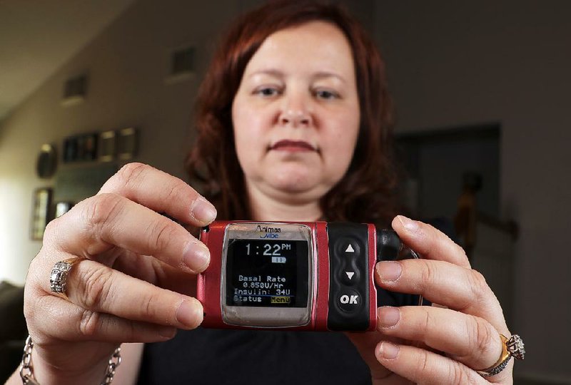 Stephanie Rodenberg-Lewis of Katy, Texas, now uses an Animas Corp. insulin pump. She says “it’s unfair” that UnitedHealth Group is pushing her to go back to her old device. 