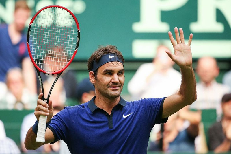 Roger Federer of Switzerland celebrates his victory in the match against Jan-Lennard Struff of Germany during the Gerry Weber Open ATP tennis tournament in Halle, Germany, Wednesday June 15, 2016. 