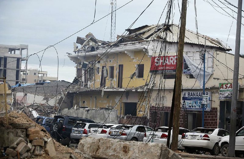 Damage to the Nasa-Hablod hotel in Mogadishu, Somalia, is seen Saturday after gunmen linked to the Islamist extremist group al-Shabab stormed the building and killed several people. 