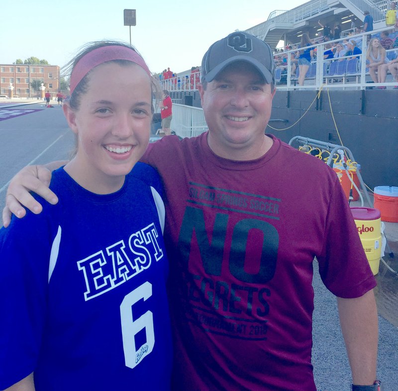 Photo submitted Former Siloam Springs soccer standout Grace Simpson and SSHS soccer coach Brent Crenshaw pose for a photo after Simpson participated in the Arkansas High School Coaches Association All-Star Girls Soccer Match on Wednesday at Estes Stadium on the campus of Central Arkansas in Conway.