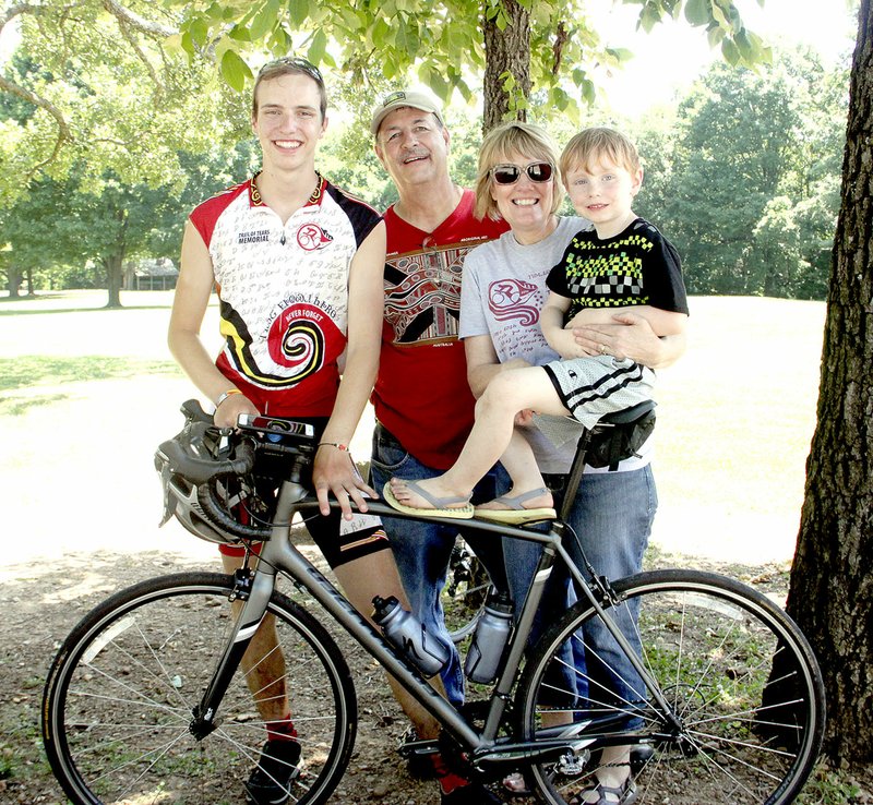 LYNN KUTTER ENTERPRISE-LEADER Glendon VanSandt, left, of Siloam Springs, stands with his grandparents, Annette and Earl Rowe of Lincoln, and his younger brother, Canyon VanSandt. Glendon was one of 10 cyclists chosen to participate in the Cherokee Nation&#8217;s 2016 Remember the Removal Bike Ride. The ride ended Thursday in Tahlequah, Okla., but the group made a stop at Prairie Grove Battlefield State Park on Wednesday for lunch and to learn some Civil War and Cherokee history.