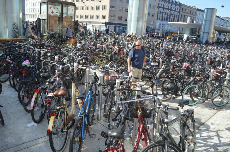 Worth Sparkman, a public relations manager for Tyson Foods who was part of a Northwest Arkansas delegation attending the CityBuilders Symposium in Copenhagen, Denmark, looks over thousands of bicycles parked near the Norreport metro station stop on June 5. All metro stations in the heart of Copenhagen have large parking areas for commuters’ bicycles.
