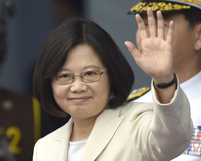  In this May 20, 2016 file photo, Taiwan's Tsai Ing-wen waves at the venue of her inauguration at the Presidential Office Building in Taipei, Taiwan. 