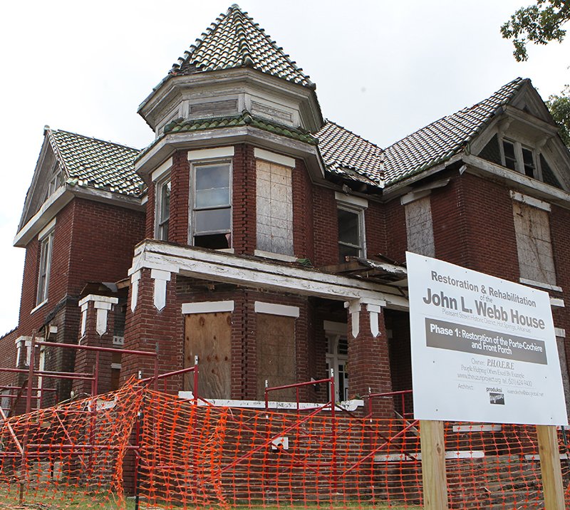 The Sentinel-Record/Richard Rasmussen PHASE ONE: Phase one of the three-phase, three-year project to restore the John Lee Webb house, located at 403 Pleasant St., is well underway, with workers removing all the rotting wooden portions of the porch and porte cochere while leaving the brick portions. Organizers of the renovation plan to convert the house into a community resource center and museum of local black history.