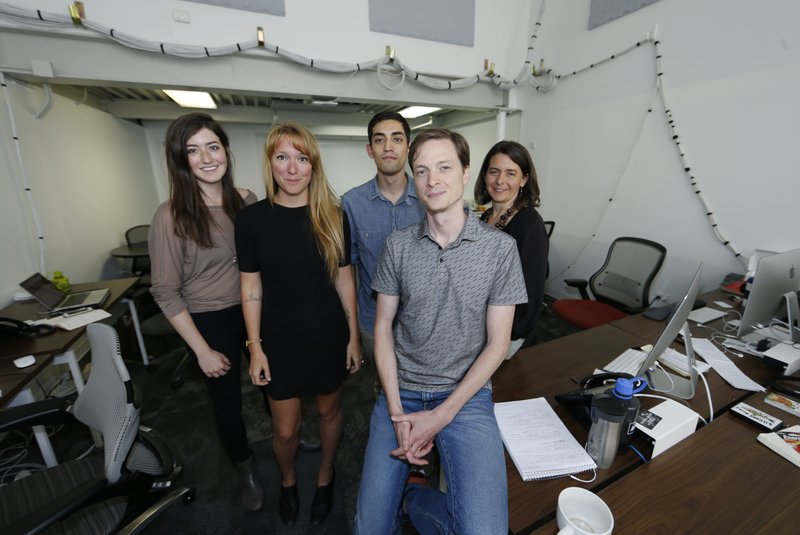 In this Friday, June 17, 2016, photograph, members of the Denverite, a news startup based in Denver, pose for a picture in the venture's office. Editor Dave Burdick, front, is flanked by some of the site's co-workers, from left, Chloe Aiello, Ashley Dean, Adrian Garcia and Erica Meltzer. 