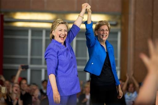 Democratic presidential candidate Hillary Clinton, accompanied by Sen. Elizabeth Warren, D-Mass., arrives to speak at the Cincinnati Museum Center at Union Terminal in Cincinnati on Monday, June 27, 2016.