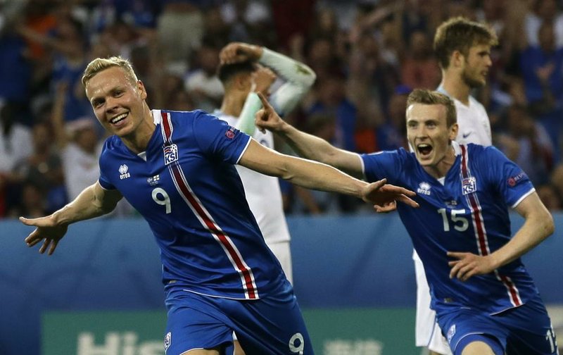 Iceland’s Kolbeinn Sigthorsson (left) and Jon Dadi Bodvarsson react after scoring what turned out to be the game-winning goal during the 18th minute of their 2-1 upset victory over England in the second round of the European Championship on Monday at Allianz Riviera Stadium in Nice, France.