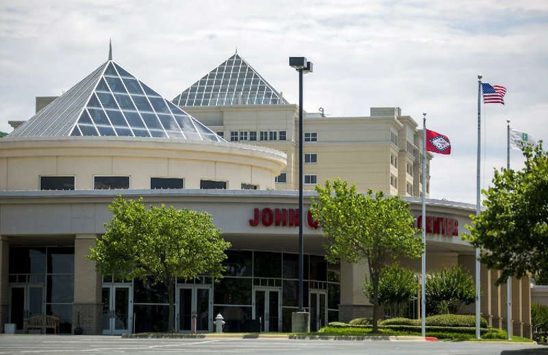 The John Q. Hammons Center and Embassy Suites in Rogers, shown here, are among 70 properties across the nation that are part of a bankruptcy filing. The filing is in response to a legal dispute with a former investor.