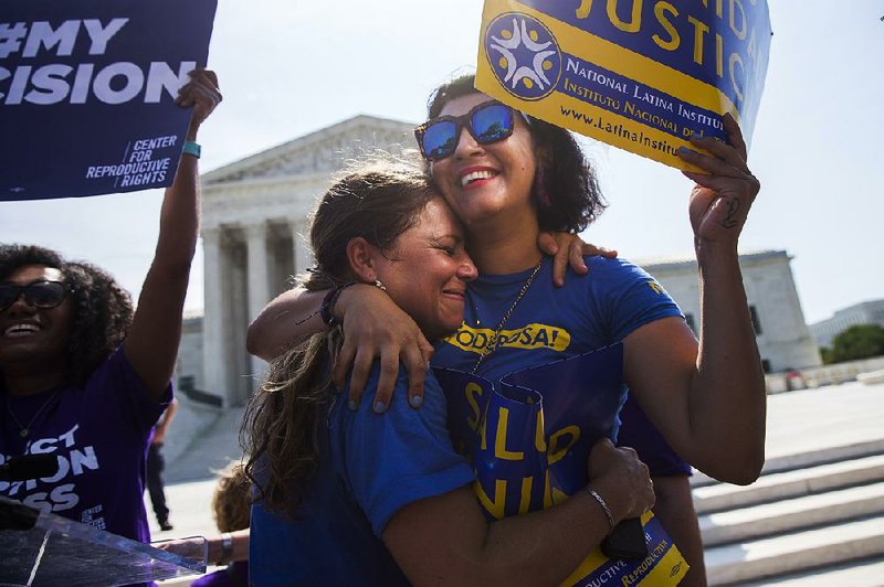 Bethany Van Kampen (left) hugs Alejandra Pablus as they celebrate Monday during a rally at the Supreme Court in Washington after the court struck down Texas’ regulation of abortion clinics.