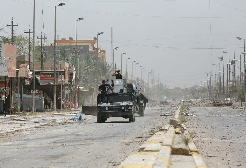 Iraqi counterterrorism forces patrol Fallujah, Iraq, on Monday.