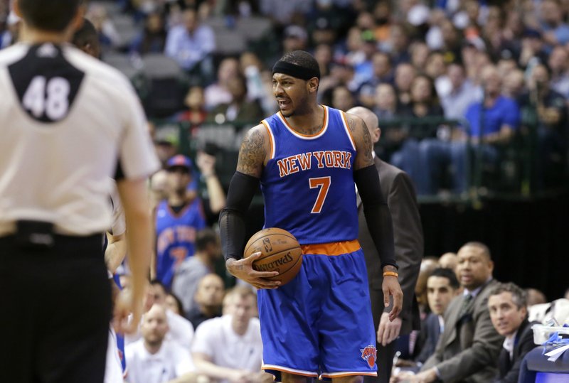 FILE - In this March 30, 2016 file photo, New York Knicks forward Carmelo Anthony (7) reacts to a call during the second half of the team's NBA basketball game against the Dallas Mavericks in Dallas. A person with knowledge of the details says Anthony has agreed to chase a fourth Olympic men&#x2019;s basketball medal, while Toronto teammates Kyle Lowry and DeMar DeRozan will also play for the U.S. The person told The Associated Press on Thursday, June 23, 2016 that the Americans were still awaiting decisions from LeBron James and Kyrie Irving but had solidified 10 of their 12 roster spots. (AP Photo/LM Otero, file)