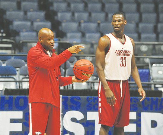 NWA Democrat-Gazette/Michael Woods HOG LEADERS: Arkansas coach Mike Anderson works with all-Southeastern Conference center Moses Kingsley and the rest of the Razorbacks during preparation for the SEC tournament March 9 in Nashville, Tenn. The Razorbacks' summer consists of school work and practice before an exhibition trip to Spain in August.