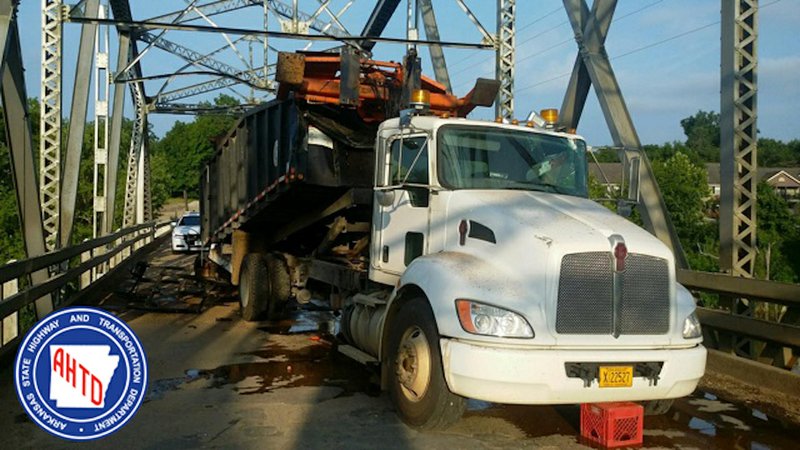 A Clark County road department truck collided with key components of the Ouachita River Bridge on Tuesday, June 28, 2016, forcing the indefinite closure of the Arkansas 51 structure in Arkadelphia. 
