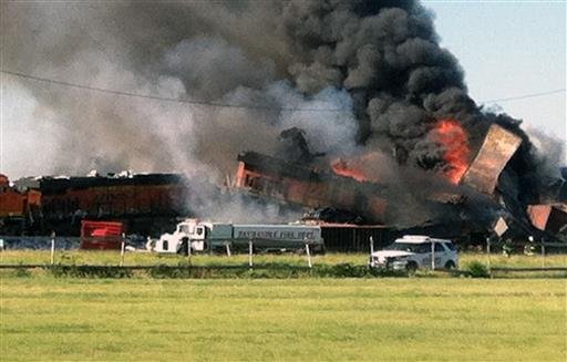 In this photo provided by Billy B. Brown, two freight trains are on fire Tuesday, June 28, 2016, after they collided and derailed near Panhandle, Texas. 