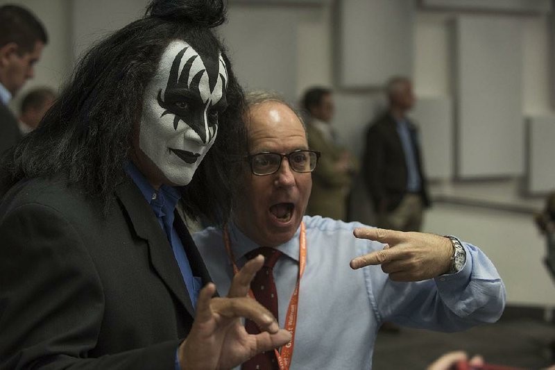 Luis Reyes, a Gene Simmons impersonator, poses with Andy Serwer of Yahoo Finance on Tuesday at Wal-Mart’s manufacturing summit in Bentonville. 