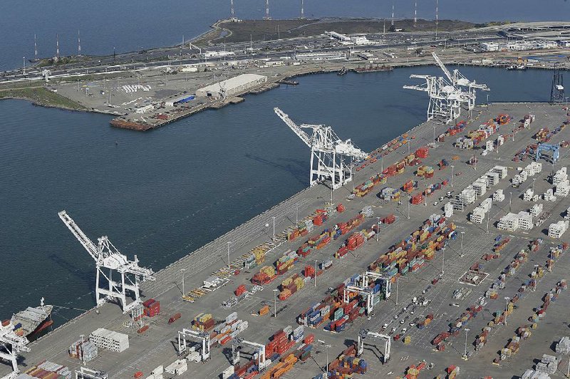 The former Oakland Army Base pier at upper left sits across a basin from the operational Port of Oakland in this file photo. Oakland officials voted Monday against using the Army pier as a terminal to transport Utah coal to Asia. 