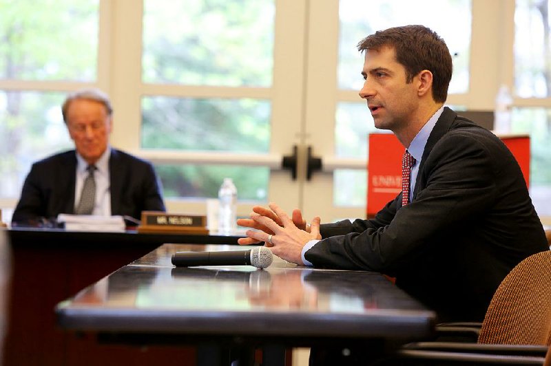 Sen. Tom Cotton (right), is shown  in this file photo addressing a meeting of the University of Arkansas System Board of Trustees in Little Rock.