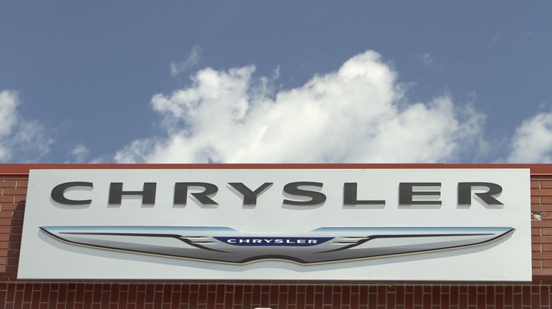 FILE - In this July 22, 2011 file photo, the Chrysler logo is displayed at a car dealership in Omaha, Neb. (AP Photo/Nati Harnik)