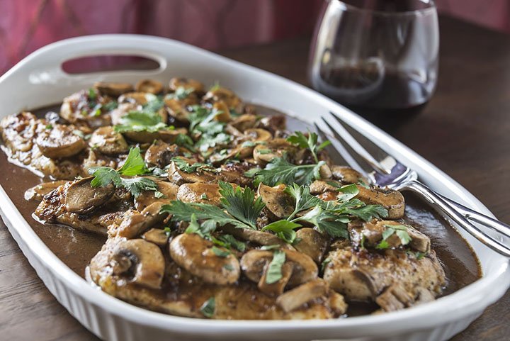 Part of the dish’s quick cooking time relies on using thinly pounded pieces, or scaloppini, of boneless, skinless chicken breast.