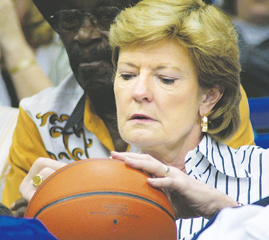 The Sentinel-Record/Mara Kuhn PAT AT THE SUMMIT: Pat Summitt, while coaching women's basketball at the University of Tennessee, signs an autograph at the 2007 Arkansas high school basketball championships at then-Summit Arena in Hot Springs. Summitt was on hand to watch Tennessee recruit Shekinna Stricklen, of Morrilton, in action against Camden Fairview. Summitt, who coached the Lady Vols to 1,098 victories and eight NCAA titles, died Tuesday at age 64 from complications of early-onset Alzheimer's disease.