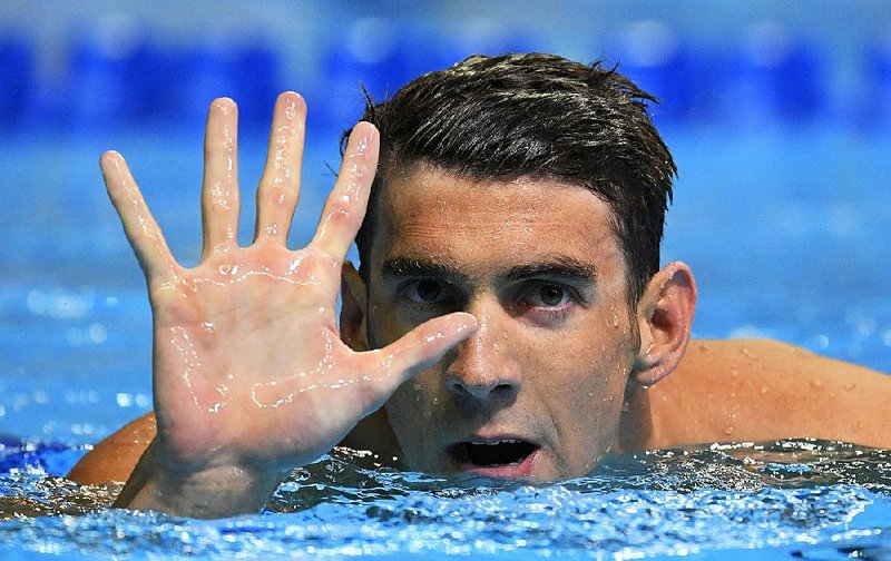 Michael Phelps won the 200-meter butterfly at the U.S. Olympic swimming trials Wednesday in Omaha, Neb., securing his fi fth trip to the Games, the most for a male swimmer ever.